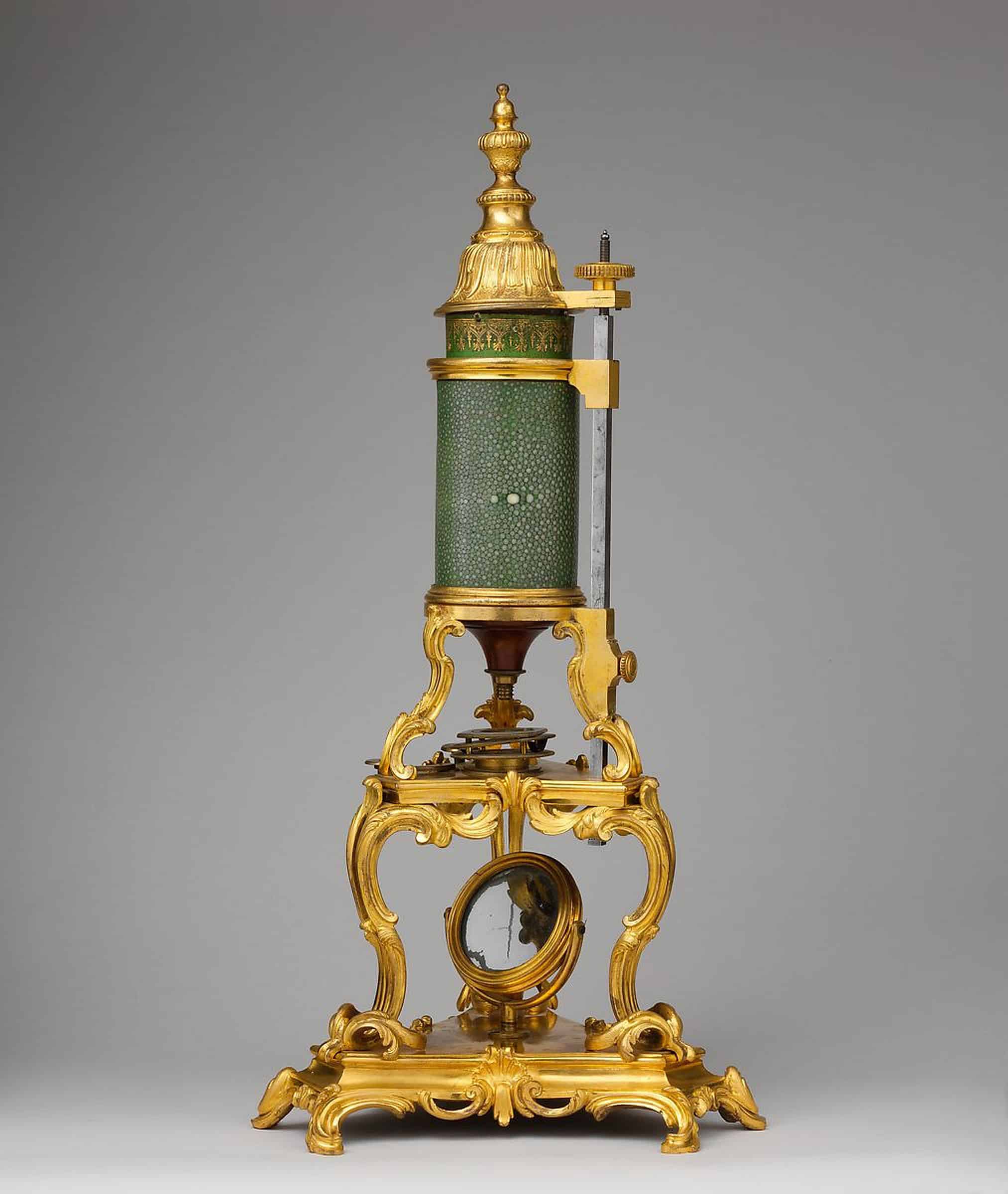 Microscope: 3 convex lenses in the inner cylinder, fitting into shagreen (snakeskin)- covered tube, with gilt-bronze finial cap and tripod stand, optics by Passemant, ingénieur du roi, France, c. 1750 photo: metmuseum.org