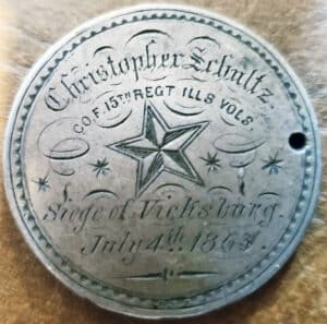 An 1859 silver dollar coin inscribed as ID for Christopher Schultz, $2,000 to $3,000.