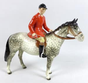 This Huntsman, model 1501, stamped “Beswick England” appeared at Batemans of Stamford in August 2019 and sold to a collector for $1,300 (with a few condition issues). Designed by Arthur Gredington, the standard chestnut version of this model is not hard to find but this dappled grey, issued from 1958-62, is one of the rarer Beswick models. In 2006, a similar model in good condition sold for $4,600.