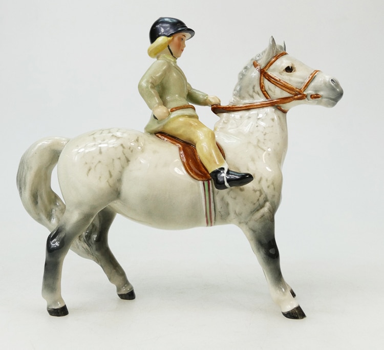Rare Beswick model of a girl on grey pony 1499 with light green jacket – top auction estimate was $1,000, sold for $1,600 in 2018.