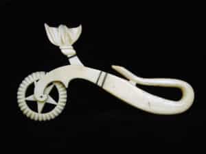 The term scrimshaw encompasses more than just engraved teeth, and includes carved items as well, such as this decorative 19th century pie crimper. photo: New Bedford Whaling Museum