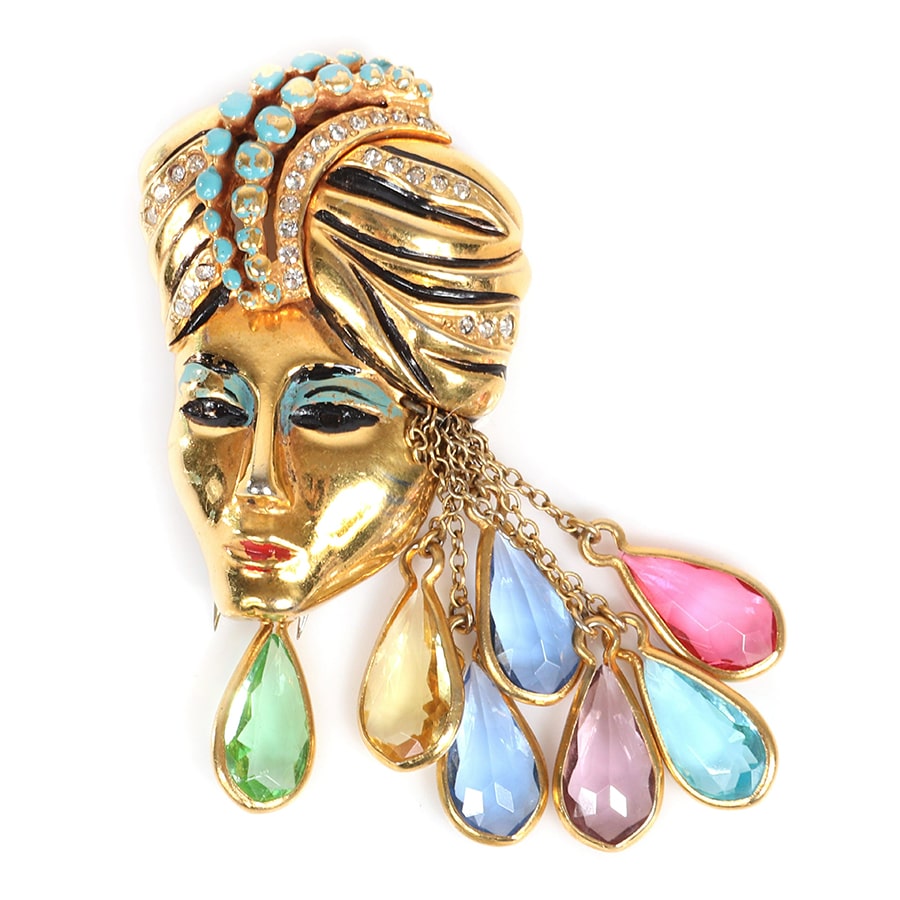 Eisenberg Originals gold-plated Sinbad figural fur clip with turbaned head with pave and enamel detailing and multi-colored teardrop framed rhinestone dangles, circa 1940. Sold for $1,250