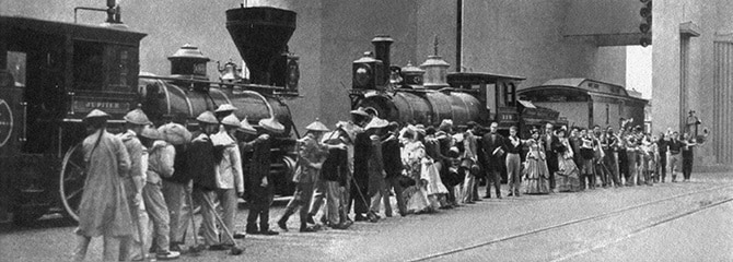 At left: “The Wedding of the Rails” pageant re-enactment of the 1869 driving of the last spike at Promontory Point, Utah, as the Pacific Railroad is finished.