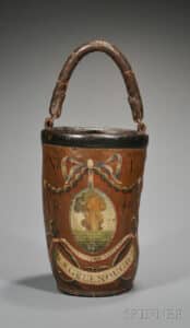4. Beyond names, dates, and logos, fire buckets could also display contemporary themes or symbolic imagery. This Fenno example, ca. 1812, belonged to David Stoddard Greenough, Jr., a lawyer and Massachusetts Justice of the Peace. Sold by Skinner in 2011, they attribute its illustration of a fiery volcanic eruption to the commemoration of two noteworthy eruptions that happened in 1812, the eruption of Soufriere on St. Vincent Island in the Caribbean, and Awu on the Sangihe Islands in Indonesia. Greenough’s bucket sold for $8,500. photo: Skinner Auctioneers