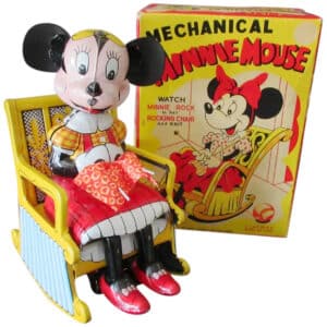 Tin wind-up Linemar mechanical knitting Minnie Mouse. On the back of the rocking chair are the Walt Disney Productions copyright, the Line-Mar-Toys Japan logo, and the Line Mar Co. Inc. copyright. 1950s with original box.