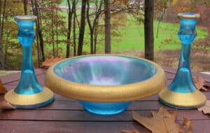 The gold-encrusted Blue Trumpet Stretch Console Set brings this idea to a different level – a bit more formal yet too beautiful not to have on display. This version was made by Central Glass Works in the early 1900s. It is for sale at www.carnivalglass.com for $175.