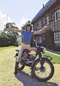 Keith Richards straddles a self-rebuilt Bushman motorcycle on the grounds at Redlands, in 1969.