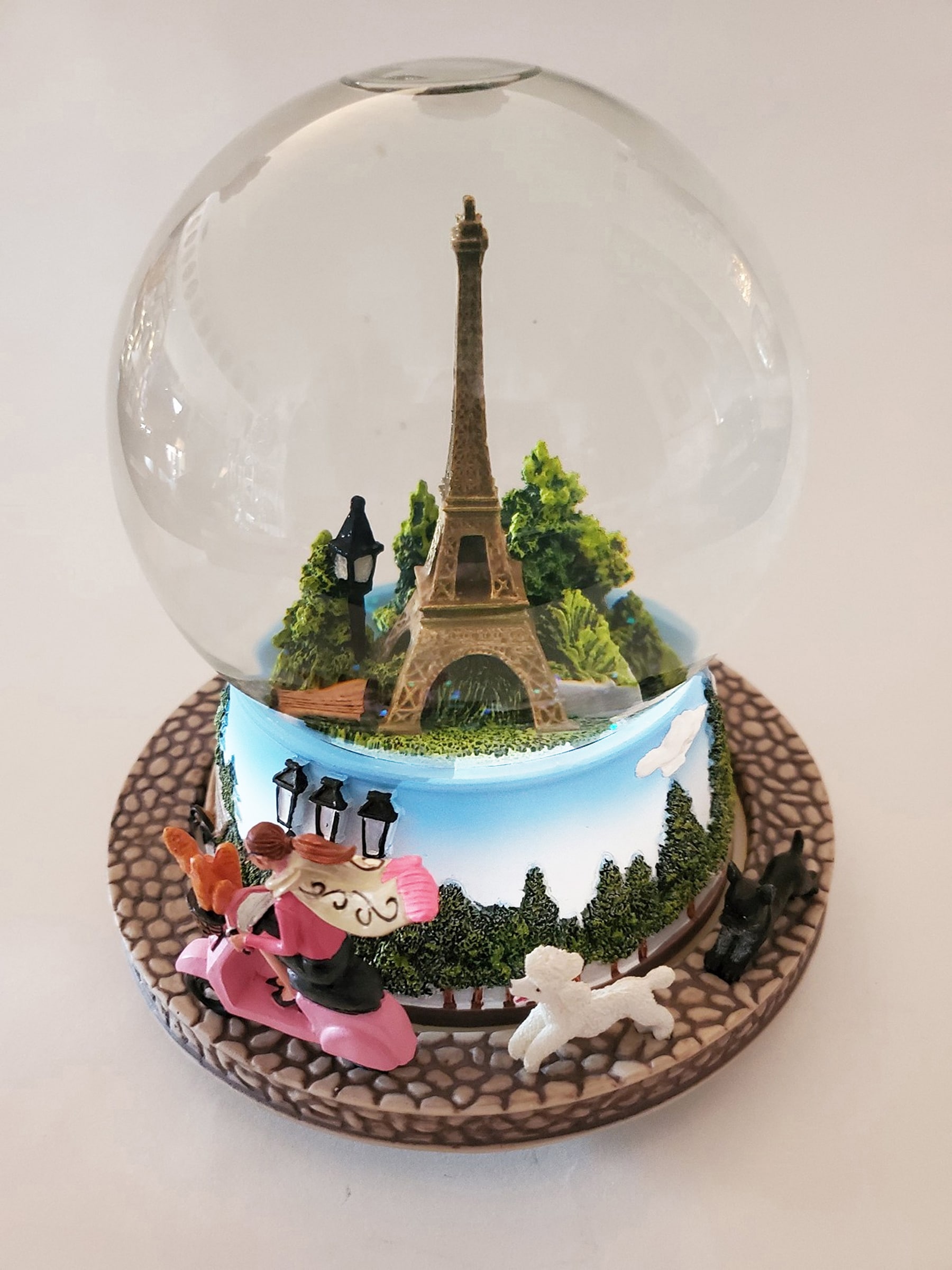 Saluting one of the first snow globes: the Eiffel Tower, recreated in a souvenir snow globe from the Paris resort, Las Vegas.