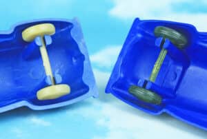 Look closely at the base of the axle towers (where they attach to the inside of the body) on each car and you’ll see the obvious differences.